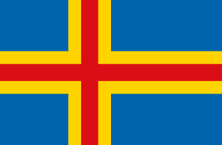 The flag of the Åland Islands has a blue field with a large golden-yellow-edged red cross that extends to the edges of the field. The vertical part of this cross is offset towards the hoist side.