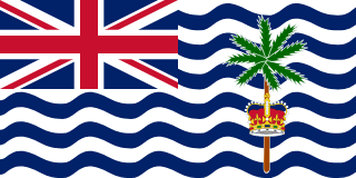 The flag of the British Indian Ocean Territory is white with six blue, wavy, horizontal stripes. The UK flag is in the canton. The striped section has a palm tree and yellow crown centered in the fly half.